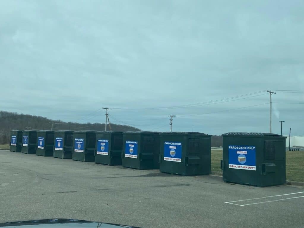 Recycling bins in parking lot