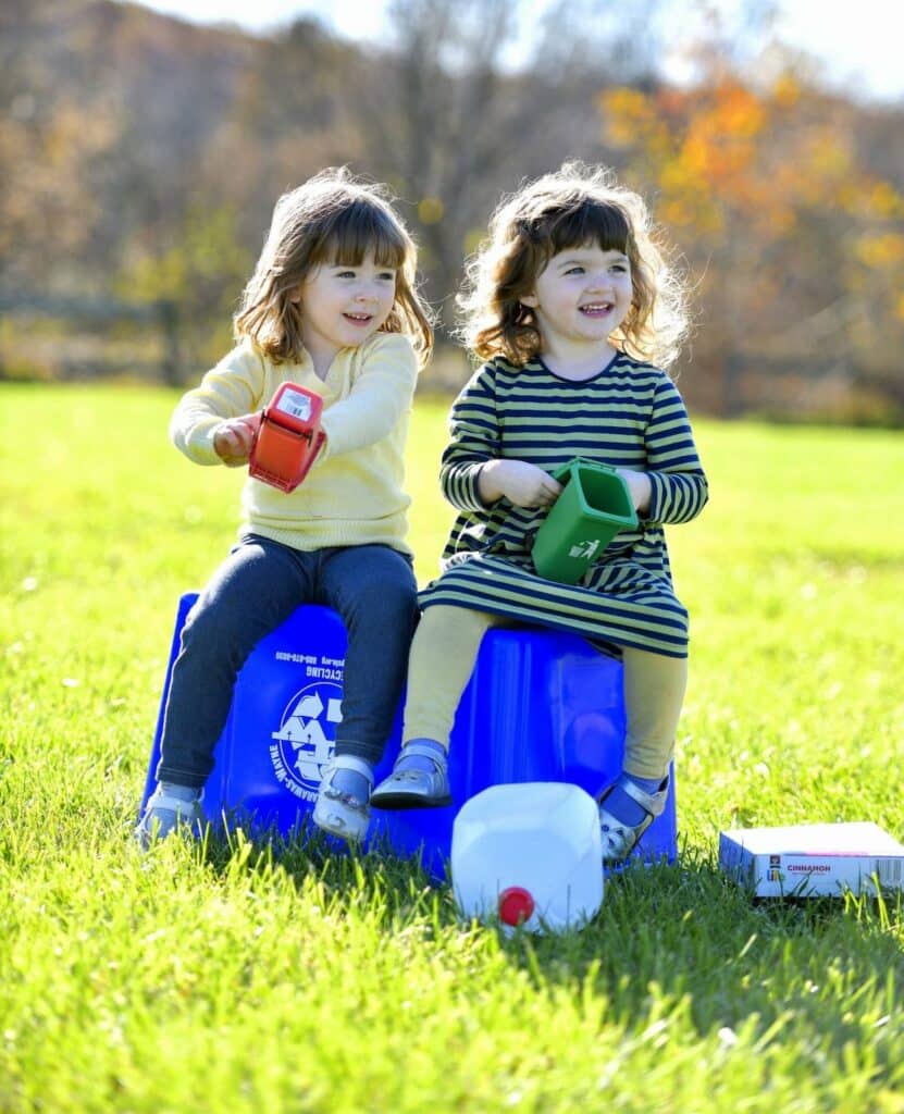 Girls on recycling bin